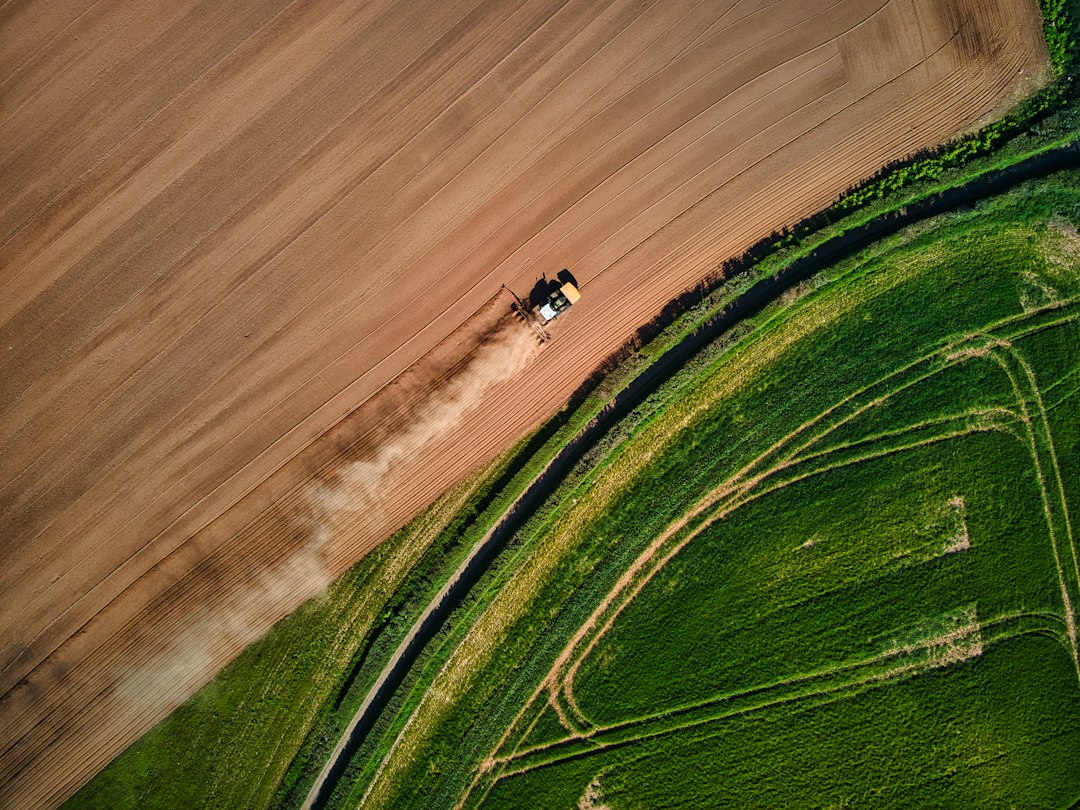 Aerial drone view of farmland, where many Section 44807 exemption holders fly agricultural spray drones