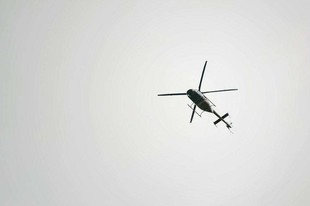 Low-flying helicopter seen from below, the kind of crewed aircraft electronic conspicuity rules under Part 108 would affect