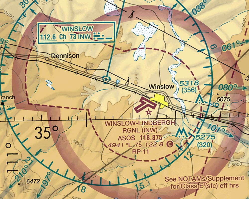 Excerpt of the FAA Phoenix Sectional chart around Winslow-Lindbergh Regional Airport, showing a dashed magenta Class E surface area