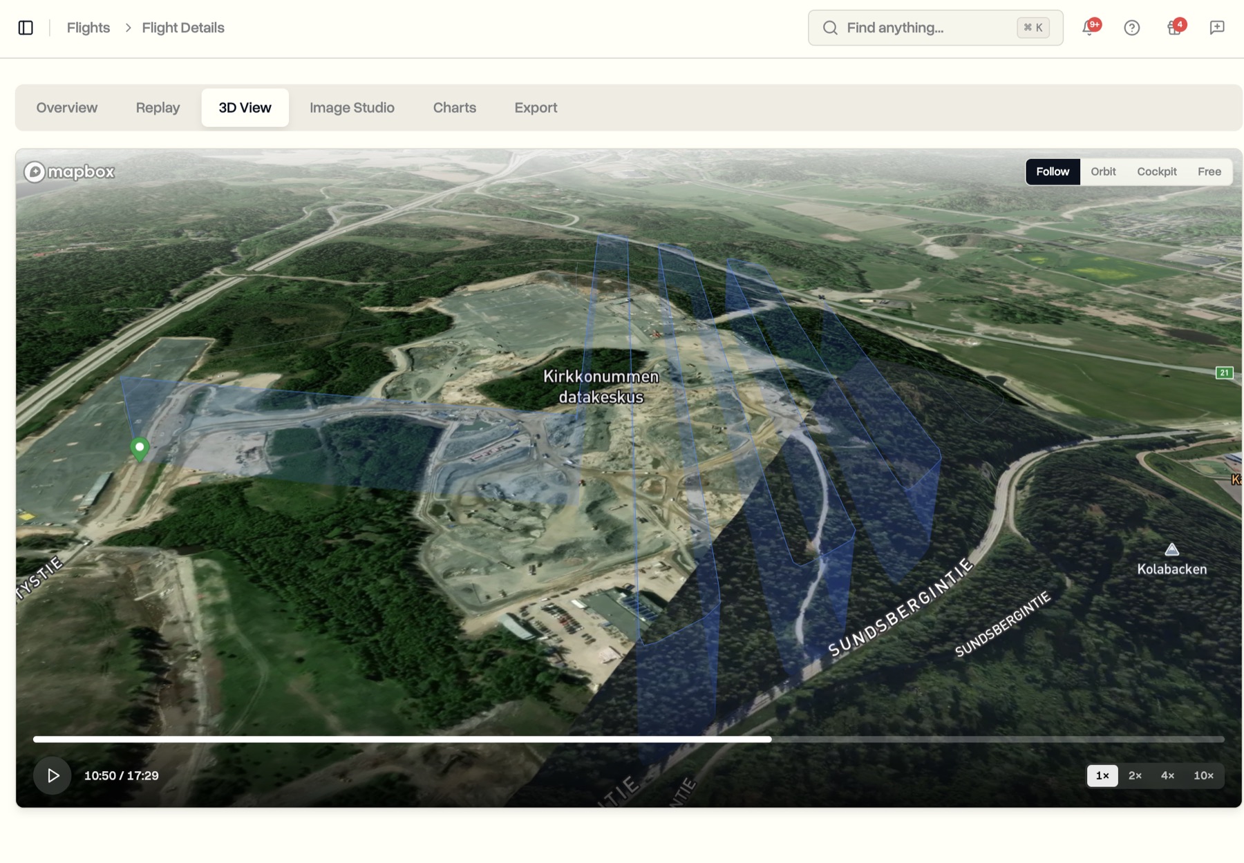 A drone flight shown in 3D over satellite terrain, the camera following the aircraft along its glowing flight path