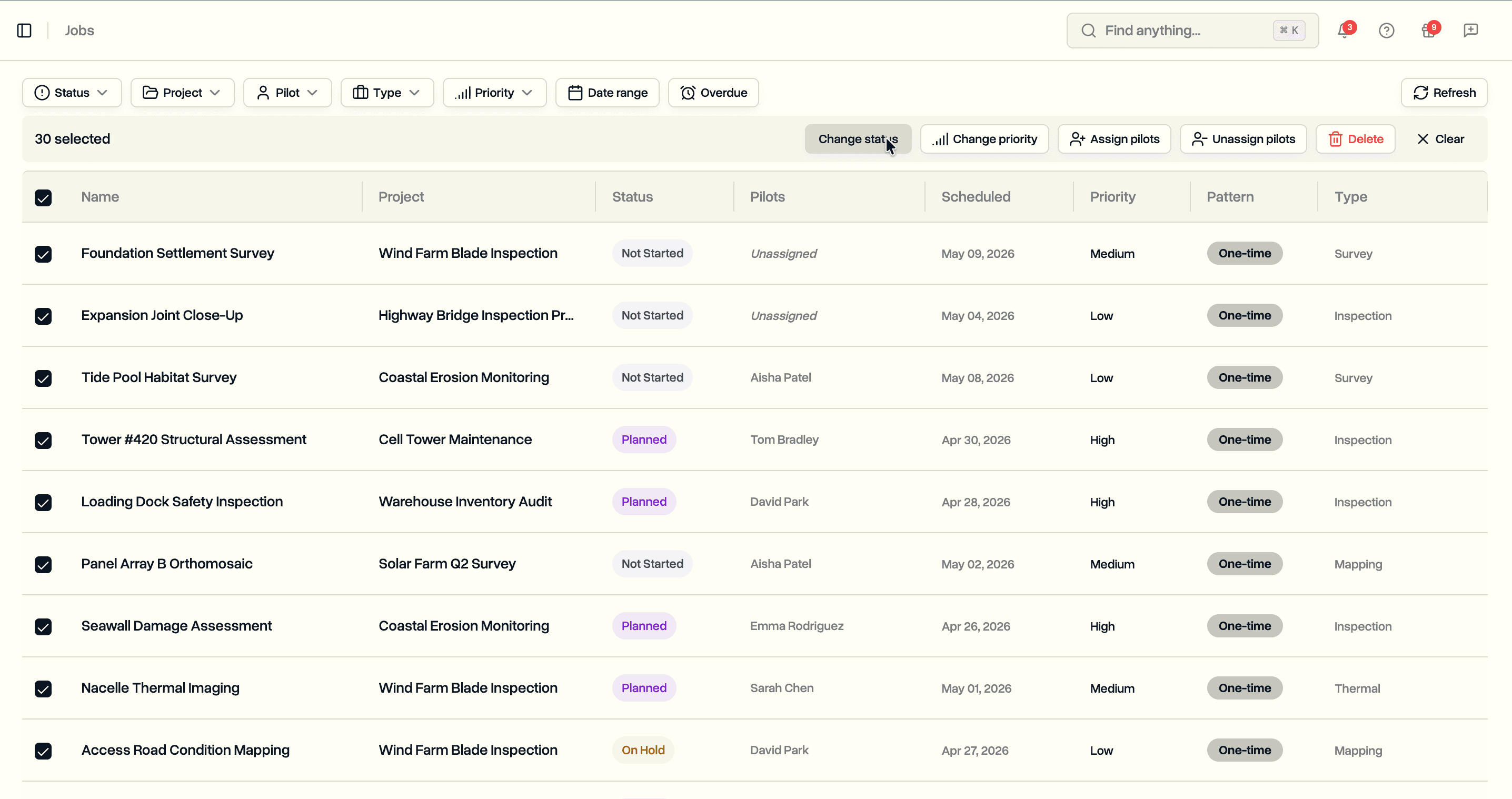 Bulk toolbar with selection count, Change status, Assign pilots, Unassign pilots, and Delete buttons